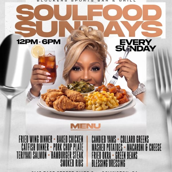 A woman holding iced tea and a fork, with a plate of fried chicken, mac and cheese, and collard greens.