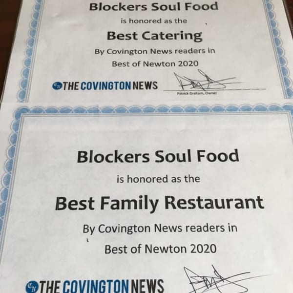 Two Blockers Soul Food certificates for "Best Catering" and "Best Family Restaurant" from Covington News.